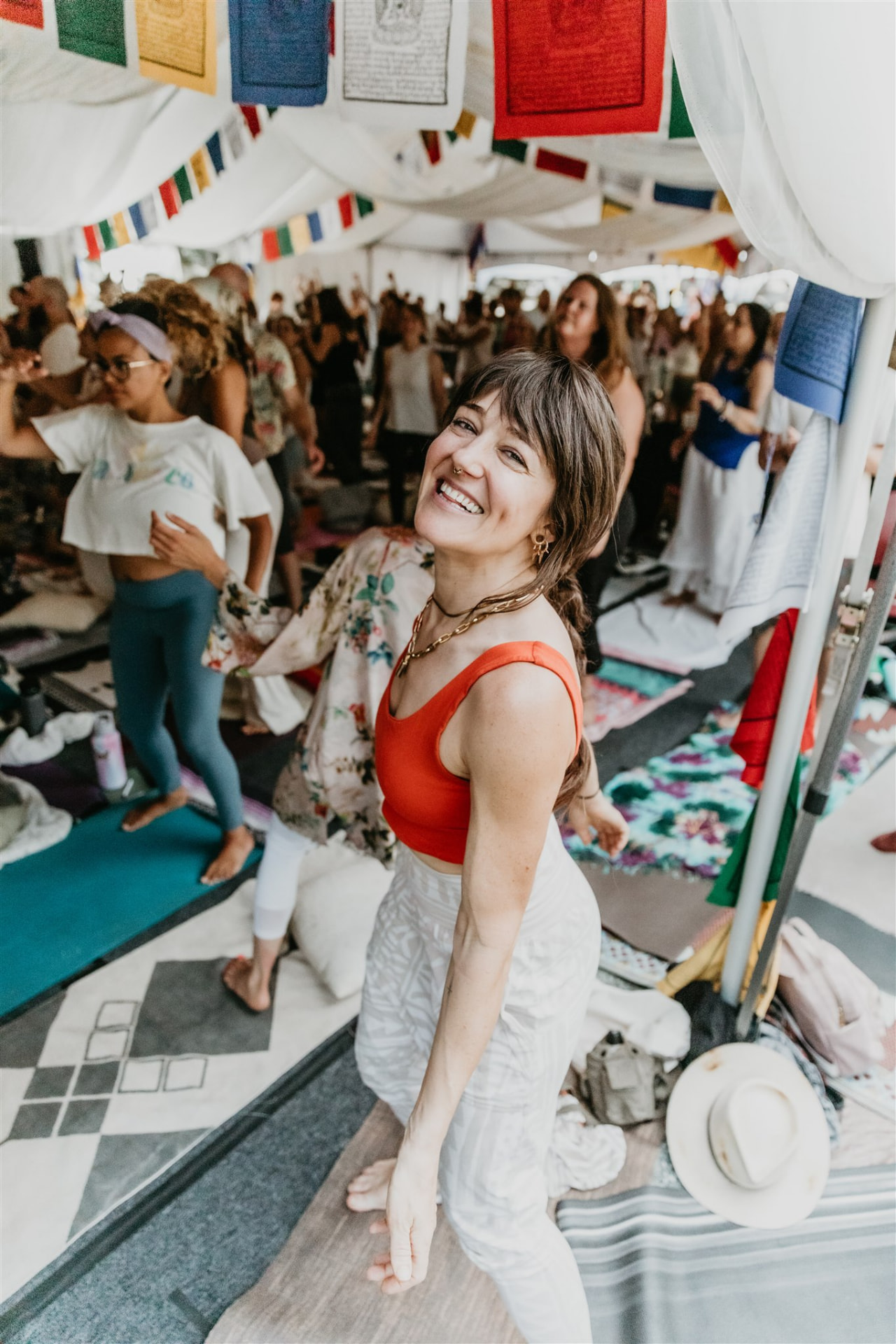 Participant smiling during a joyful moving meditation